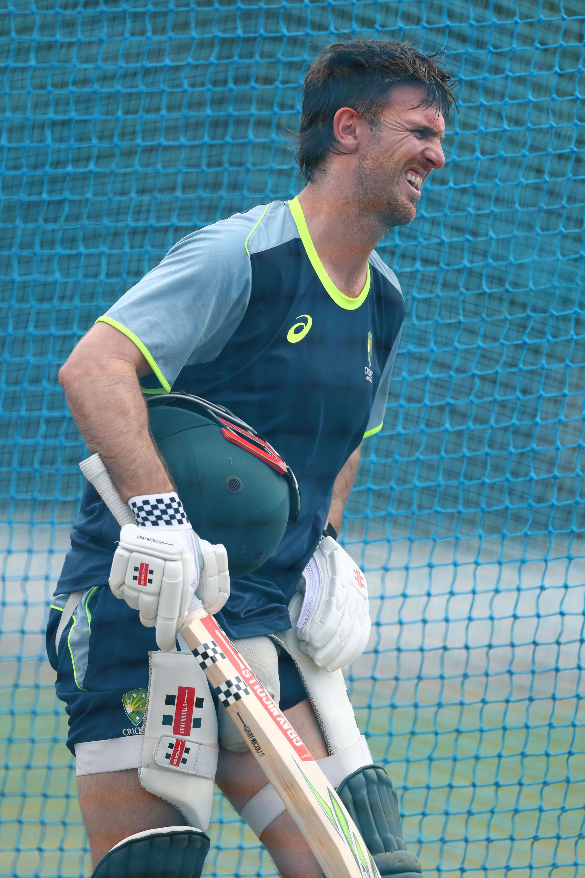 Marsh reacts after he was struck by the ball during a training session at the Colombo Cricket Club Ground on Sunday // Getty